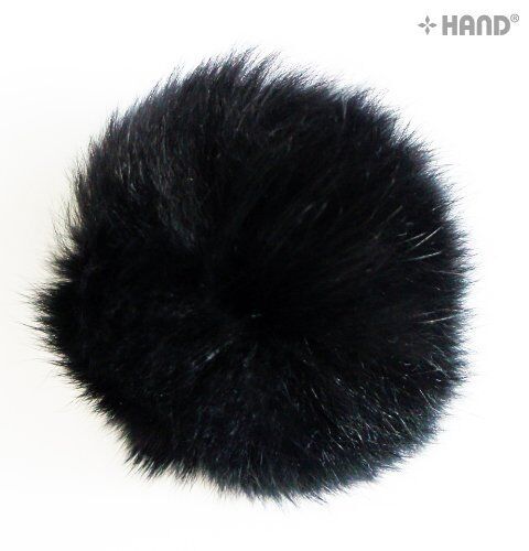 Close-up view of a black rabbit bobble ball trim showing texture