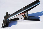Fabric clamps displayed with various sewing tools.