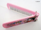 Brightly coloured children's hair brush with fun graphics