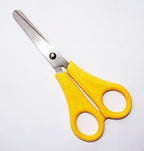 Close-up of kids-safe scissors with a blunt tip for safe use