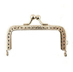 Flat lay of the coin purse frame showing dimensions