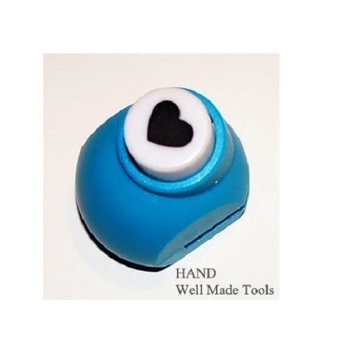 Craft paper punch being used on colourful paper