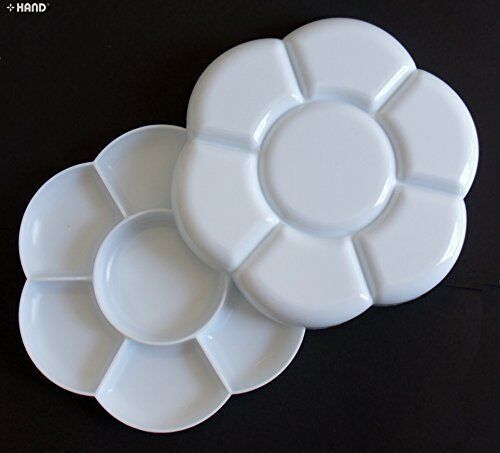 White plastic flower paint tray with 7 wells for mixing colours.