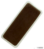 Application of leather finishing wax on a leather surface.