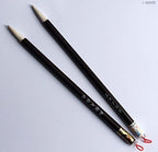 Brush handles of the sumi brushes showcasing their wooden finish