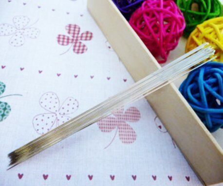 Three Bead Easy long, thin beading sewing needles on a white background.