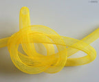 Yellow tubular crin trim displayed alongside crafting tools