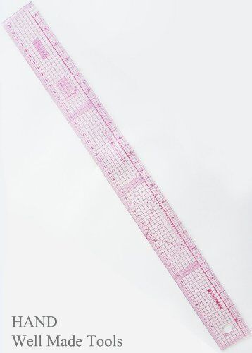 Ruler being used to measure a patchwork quilt piece