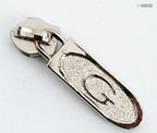 Pack of 10 silver 'G' zip pulls displayed together