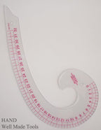 Close-up of the curve ruler demonstrating its shape and design.