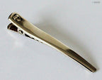 Alligator hair clips arranged neatly, highlighting their 6cm size