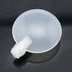 Close-up view of a single 40mm round flat squeaker.