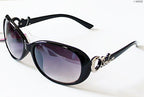 Two pairs of fashionable ladies sunglasses in assorted colours.