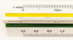 Side view showing the triangular design of the scale ruler.