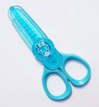 Child using kids-safe pinking scissors to cut fabric safely