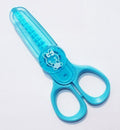 Close-up of kids-safe mini pinking scissors with colourful handles