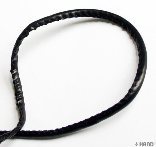 Packaging of black faux leather trim roll with dimensions