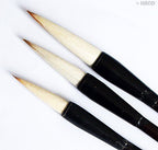 Comparison of small, medium, and large Sumi brushes.