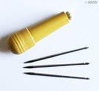 Close-up of the stitching awl showing its sharp tip and handle