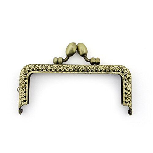Small vintage gold tone purse frame with engraved floral design.