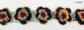 Close-up of colourful knitted flowers net trim with sequins