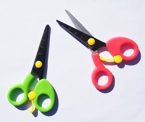 Colourful 5" blunt tip scissors for children with a measuring edge.