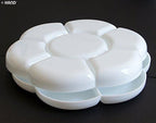 Two white plastic paint trays stacked together for easy storage.