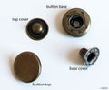 Vintage gold 4-part flat top press stud buttons displayed