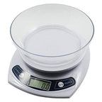 Scale on a desk with stationery items for context.