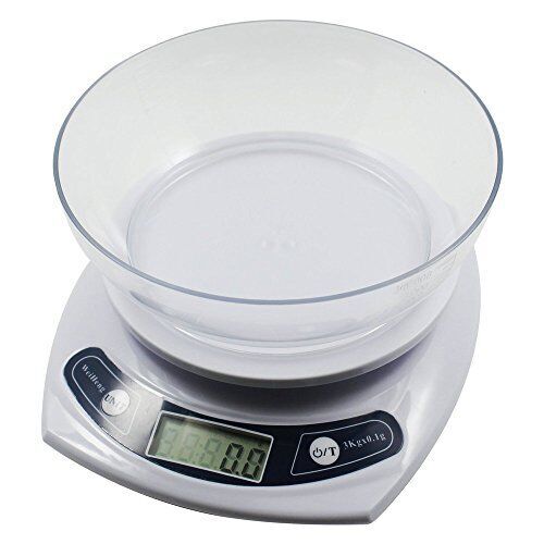 Scale on a desk with stationery items for context.