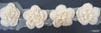 Different angles of the knitted flower with tinsel net trim