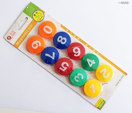 Assorted colours of magnetic numbers 0-9 displayed on a surface