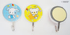 Self adhesive hooks in use, holding children's accessories on a wall.