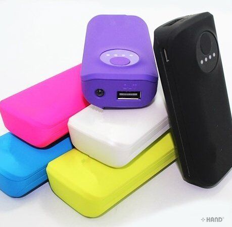 Portable power bank charging a mobile phone outdoors