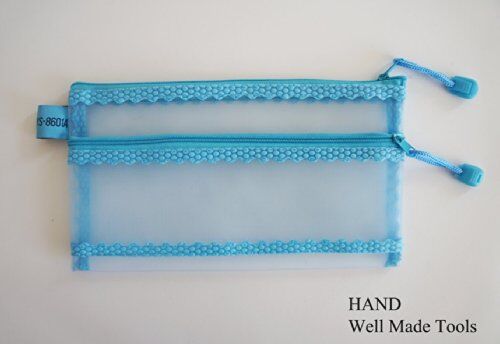 Mesh pencil pouch displayed with travel documents and notes.