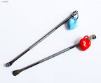 Heart keyring attached to one of the earpicks.