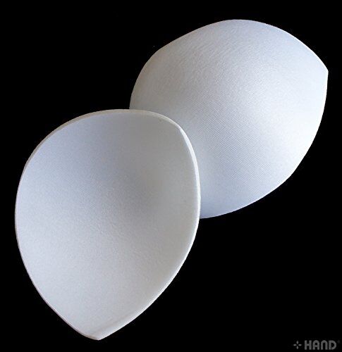 Bra pads arranged neatly, highlighting their soft material.