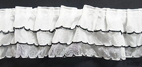 Roll of three layer white frill trim with black lines, 5 metres long.