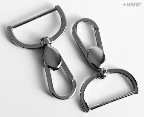Two large silver tone swivel hook buckles displayed together.
