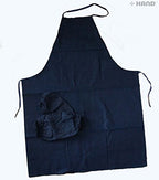 Apron and sleeve protectors in use during cooking activity