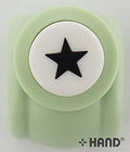 Star shape craft paper punch on a wooden table