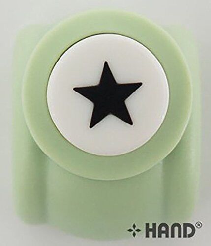 Star shape craft paper punch on a wooden table