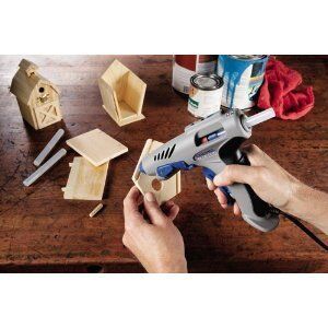 Close-up of a hot glue stick melting in a glue gun