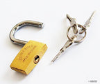 Brass padlock on a suitcase zipper