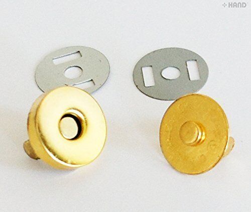 Close-up of a gold magnetic clasp button, perfect for crafts.