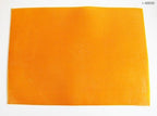 Flexible mat in use with leather materials on a flat surface.