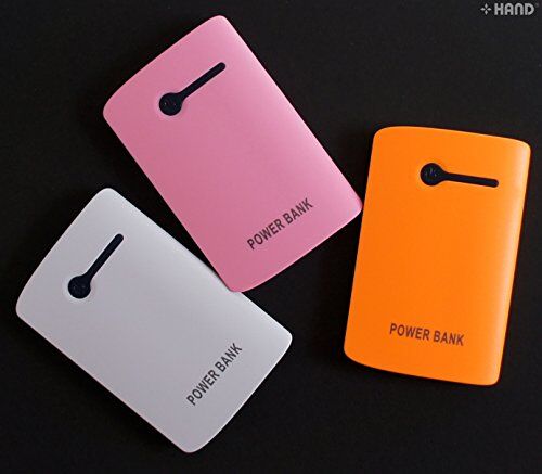 Power bank with various devices connected for charging demonstration