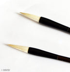 Brushes displayed on a textured surface for contrast