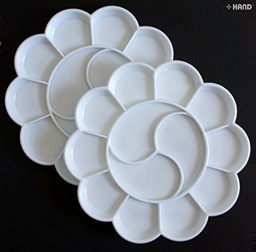 Two white plastic paint trays with 13 wells each for mixing colours.