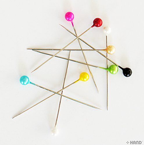 Close-up of long pearl pins showing their smooth heads